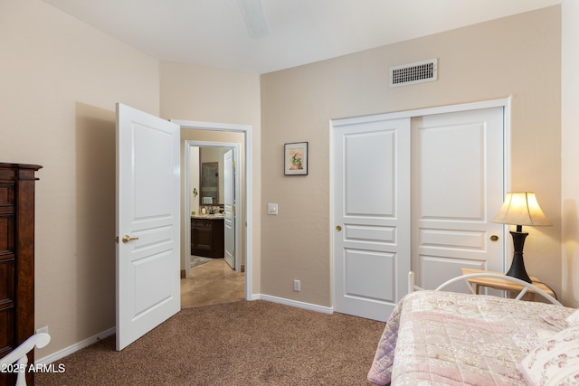 carpeted bedroom with a closet