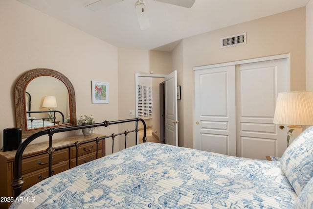 bedroom with ceiling fan and a closet