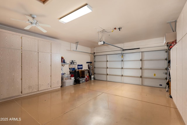 garage featuring ceiling fan and a garage door opener