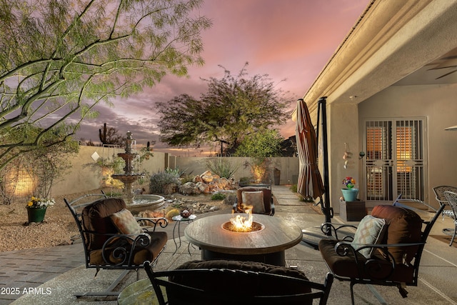 patio terrace at dusk with a fire pit