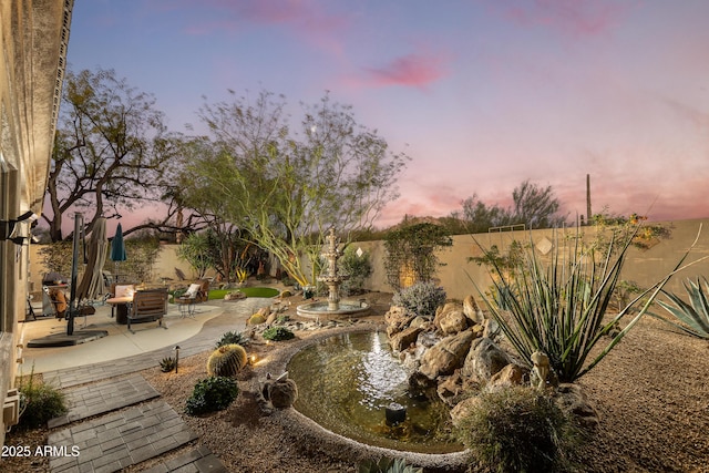 view of home's community featuring a patio