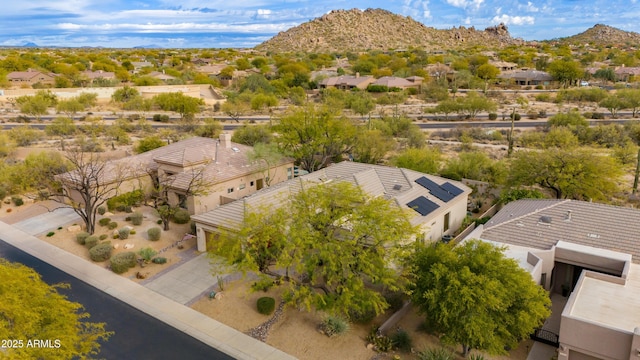 birds eye view of property with a mountain view