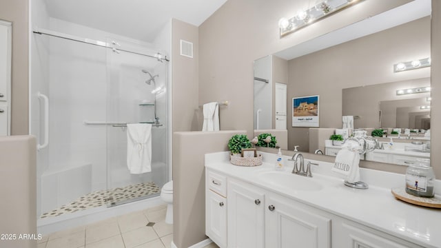 15252 N 100th St Unit 1164, Scottsdale, AZ 85260 - bathroom featuring a stall shower, vanity, and tile patterned flooring