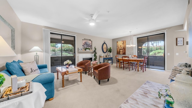 15252 N 100th St Unit 1164, Scottsdale, AZ 85260 - living room featuring carpet floors, healthy amount of natural light, ceiling fan, and a chandelier