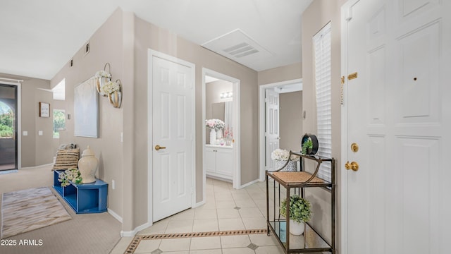 15252 N 100th St Unit 1164, Scottsdale, AZ 85260 - foyer with light tile patterned floors and baseboards