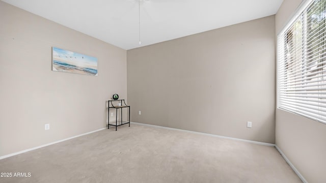 15252 N 100th St Unit 1164, Scottsdale, AZ 85260 - spare room with plenty of natural light and light carpet