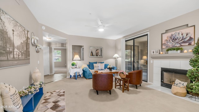 15252 N 100th St Unit 1164, Scottsdale, AZ 85260 - carpeted living room featuring a ceiling fan, tile patterned flooring, and a fireplace