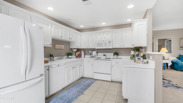 15252 N 100th St Unit 1164, Scottsdale, AZ 85260 - kitchen with white appliances, light countertops, white cabinetry, recessed lighting, and a peninsula