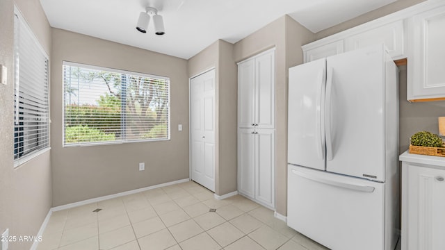 15252 N 100th St Unit 1164, Scottsdale, AZ 85260 - kitchen featuring freestanding refrigerator, white cabinets, and light tile patterned floors