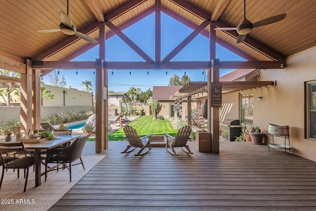 wooden terrace featuring outdoor dining space, area for grilling, a fenced in pool, and a ceiling fan