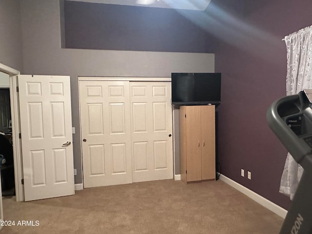 unfurnished bedroom featuring carpet floors and a closet