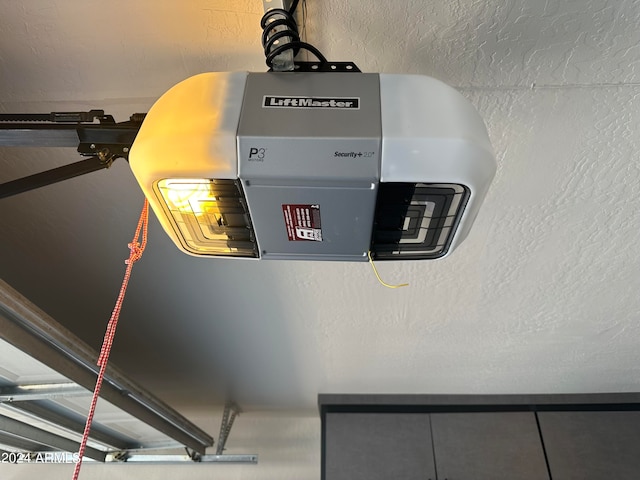 interior details with a textured ceiling and a garage door opener