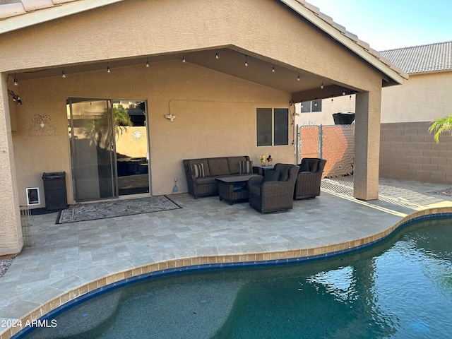 view of swimming pool featuring an outdoor hangout area and a patio