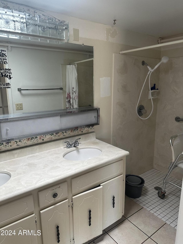 bathroom with tile patterned floors, vanity, and a shower with shower curtain