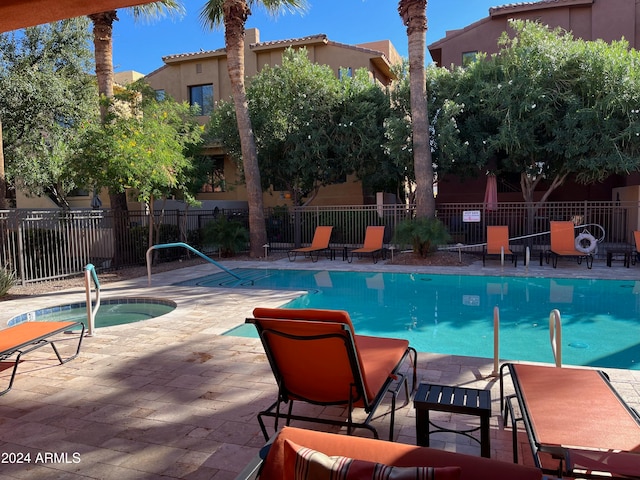 view of swimming pool with a patio area