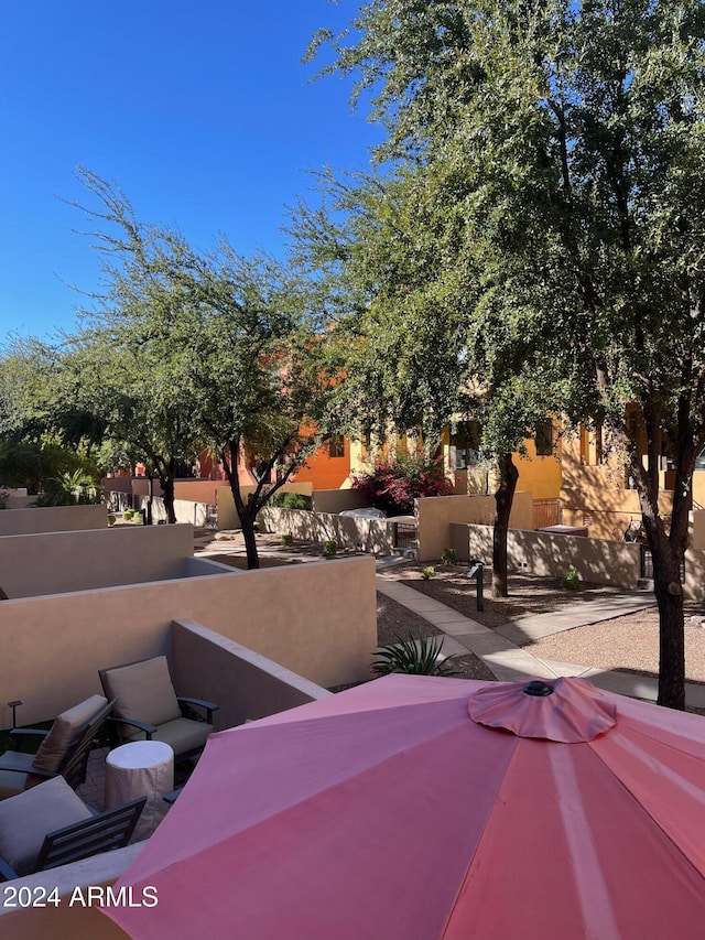 view of home's community featuring a patio area