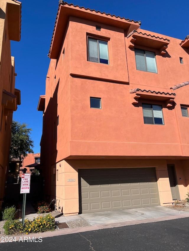 view of front of property with a garage