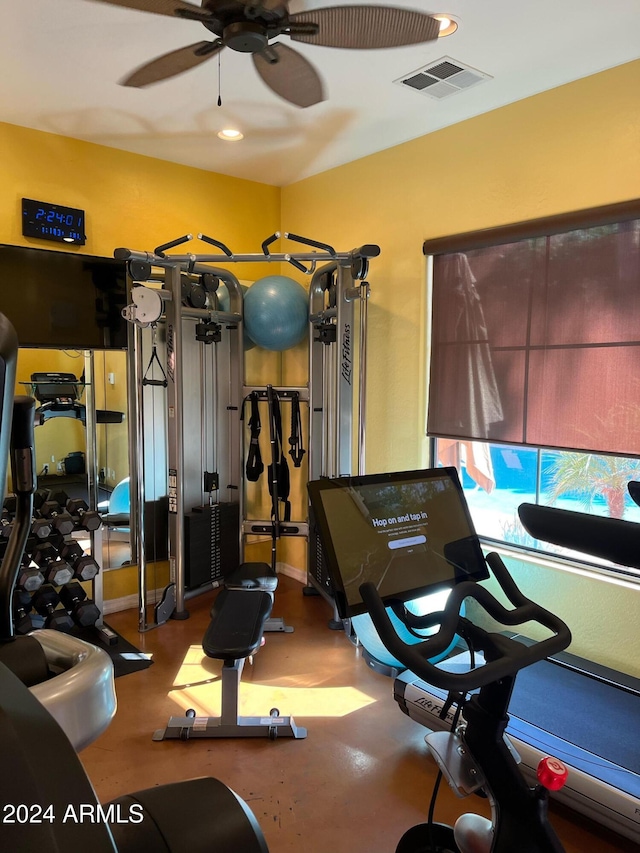 exercise room with ceiling fan