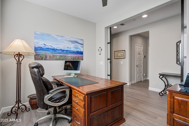 office with light wood-style flooring, recessed lighting, and baseboards