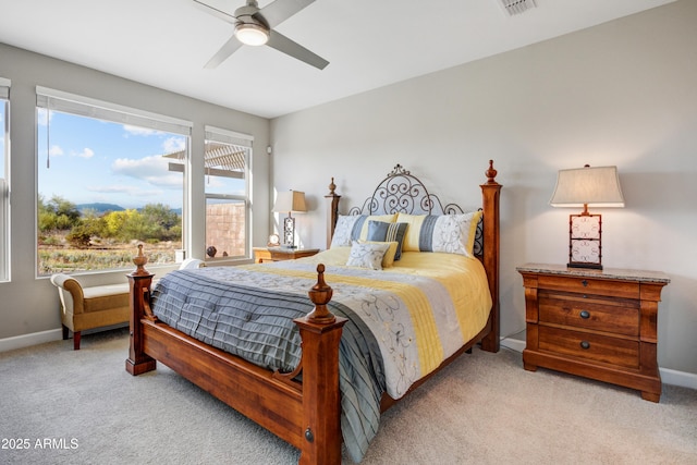 bedroom with carpet floors, baseboards, and a ceiling fan