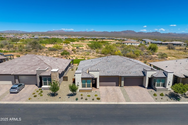 aerial perspective of suburban area featuring a mountainous background