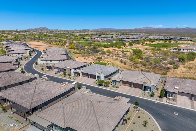 aerial view of residential area with a mountainous background