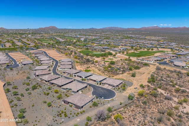 view of property location featuring nearby suburban area and a mountainous background