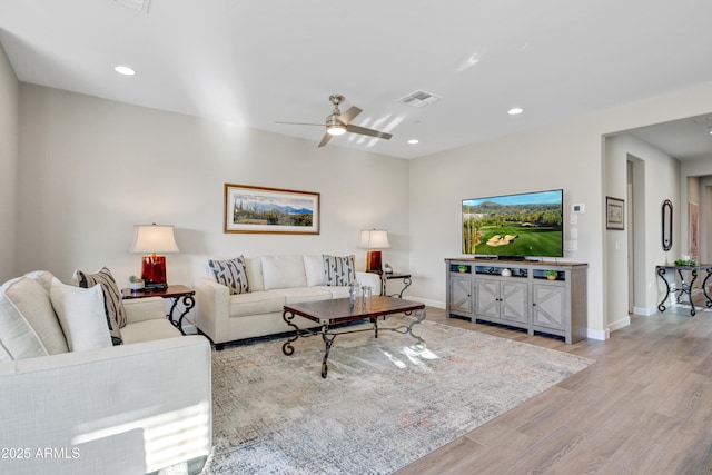 living area featuring light wood finished floors, baseboards, recessed lighting, and ceiling fan