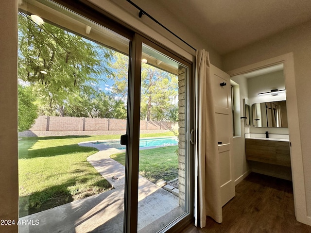4442 E Aire Libre Ave, Phoenix, AZ 85032 - doorway to outside with dark wood finished floors and baseboards