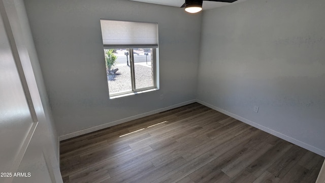 4442 E Aire Libre Ave, Phoenix, AZ 85032 - unfurnished room featuring wood finished floors, baseboards, and a ceiling fan