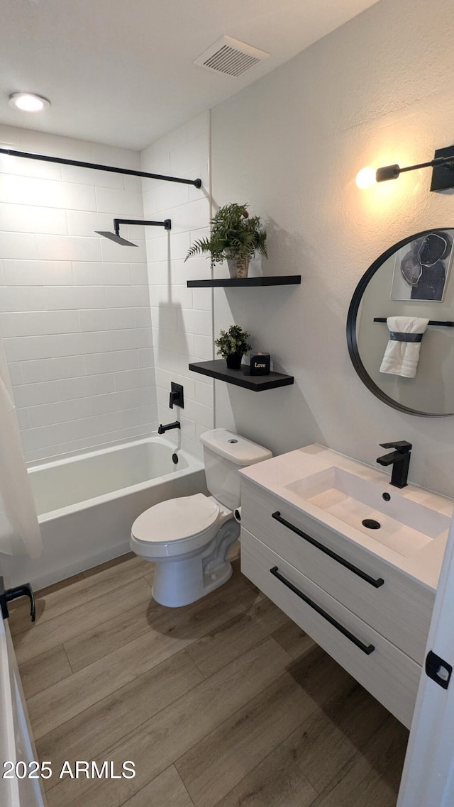 4442 E Aire Libre Ave, Phoenix, AZ 85032 - full bath featuring vanity, toilet, tub / shower combination, and wood finished floors