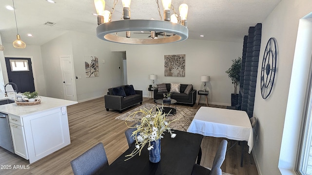 4442 E Aire Libre Ave, Phoenix, AZ 85032 - living room featuring a chandelier, light wood-style flooring, recessed lighting, and baseboards