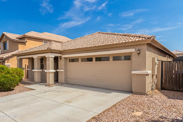 mediterranean / spanish-style house featuring a garage