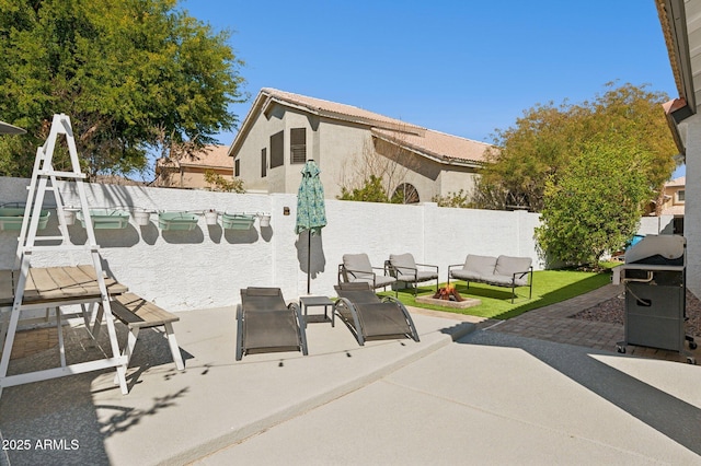 view of patio with a fenced backyard and a grill