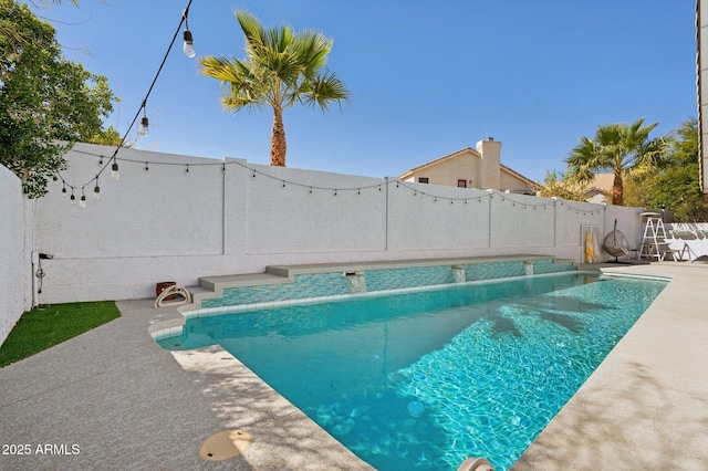 view of swimming pool with a fenced in pool, a patio area, and a fenced backyard