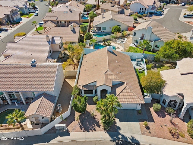 birds eye view of property with a residential view