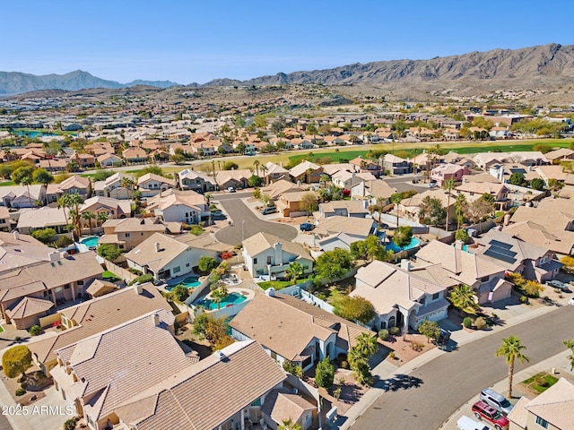 birds eye view of property with a residential view and a mountain view