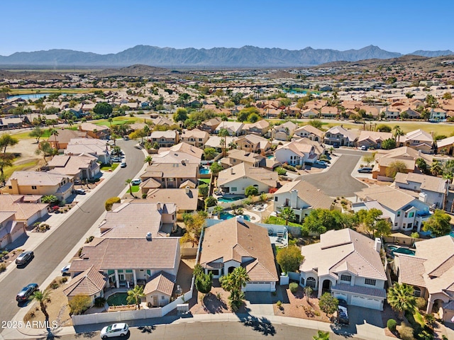 drone / aerial view with a residential view and a mountain view