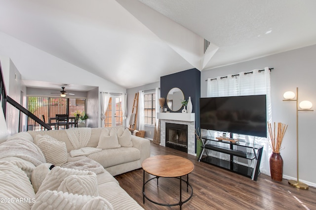 4772 W Joshua Blvd, Chandler, AZ 85226 - living area with a ceiling fan, a fireplace, dark wood-style flooring, and vaulted ceiling