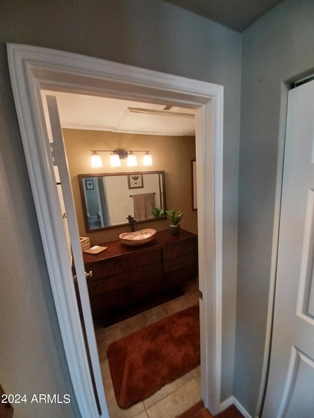 bathroom featuring tile patterned flooring and vanity