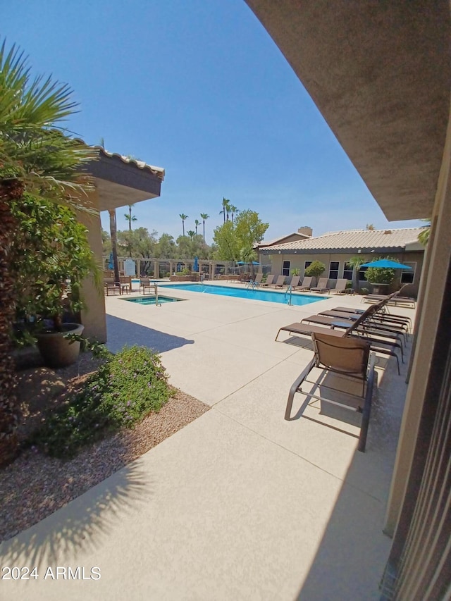 view of swimming pool with a patio area