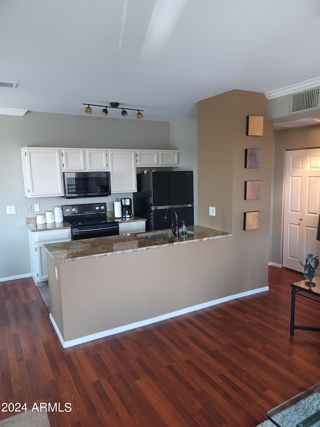 kitchen featuring black appliances, white cabinets, light stone countertops, and dark wood-type flooring