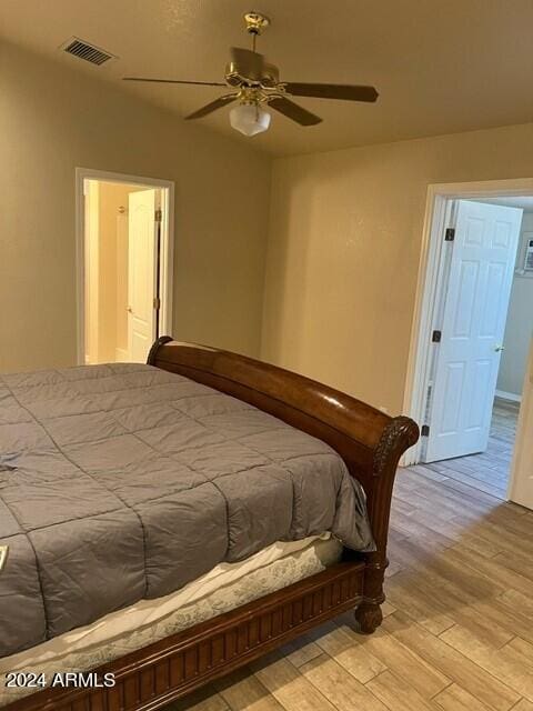 bedroom featuring light wood-type flooring and ceiling fan