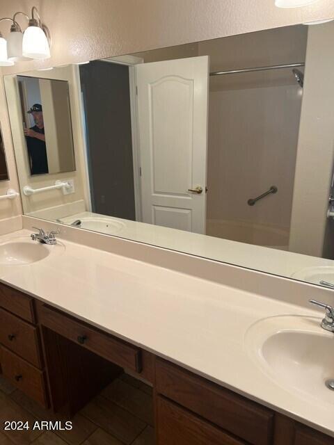 bathroom with  shower combination, vanity, and tile patterned flooring