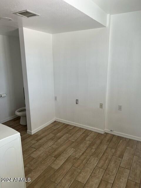 spare room featuring dark hardwood / wood-style floors