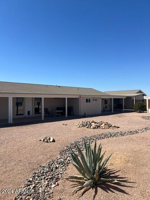 rear view of property with a patio area