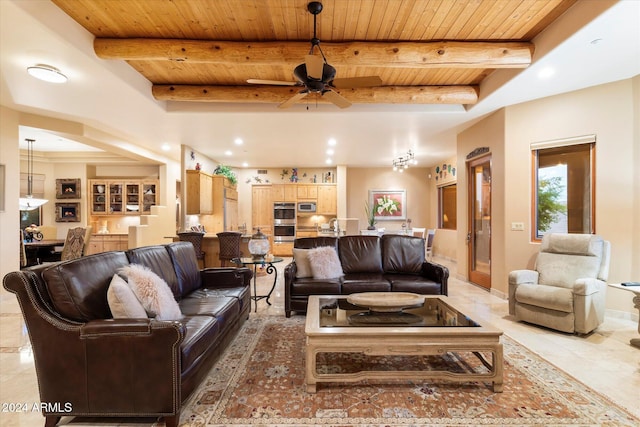 living room featuring beam ceiling, ceiling fan, and wooden ceiling