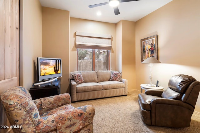 living room featuring carpet flooring and ceiling fan