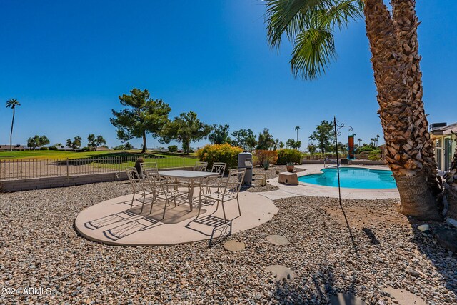 view of swimming pool with a patio area