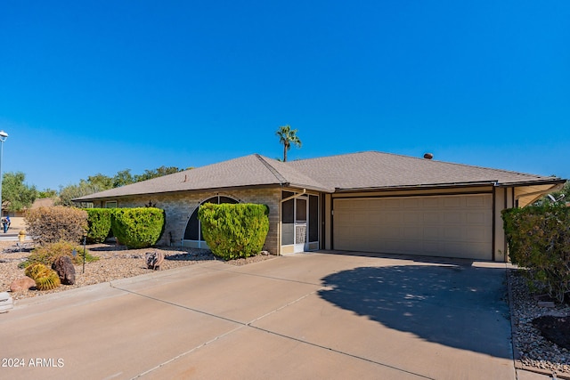 single story home featuring a garage